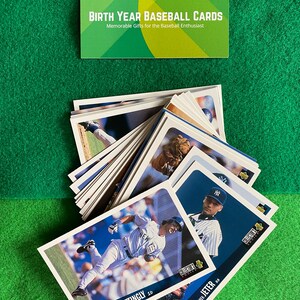May include: A stack of baseball cards featuring players from the New York Yankees. The cards are from the 1996 Collector's Choice series. The cards feature Don Mattingly and Derek Jeter.