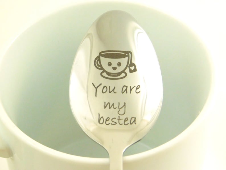 May include: A silver spoon with a cute cartoon teacup and the text "You are my bestea" engraved on it.