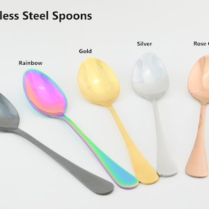 May include: Five stainless steel spoons in different colors: black, rainbow, gold, silver, and rose gold.