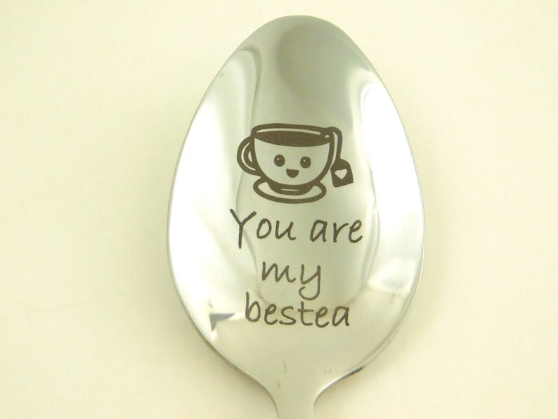 May include: A silver spoon with a cute cartoon teacup and the text "You are my bestea" engraved on it.
