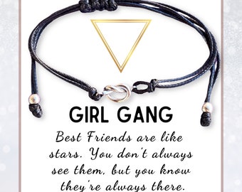 May include: Black friendship bracelet with a silver-colored knot clasp. The card behind the bracelet reads "GIRL GANG" and a quote about friendship. The bracelet is adjustable.