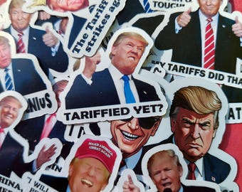 May include: A collection of stickers featuring a caricature of a man with a red tie and the text "The Tariff King strikes again!" and "Tariffs Did That". Other stickers feature the text "Tough on Tough" and "Tarrified Yet?"
