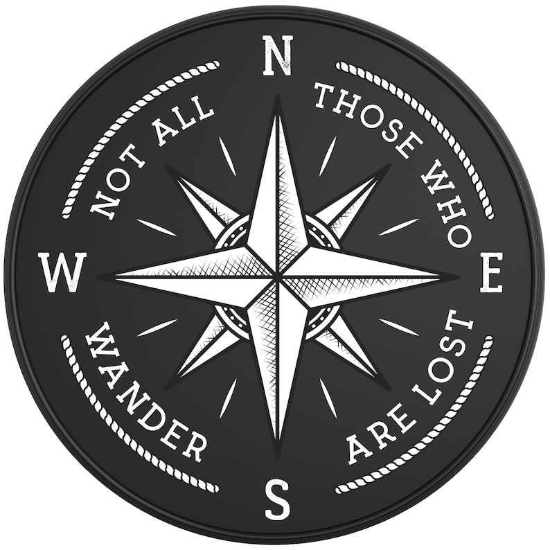 May include: Black and white compass with a white star in the center and the text "Not all those who wander are lost" around the edge.