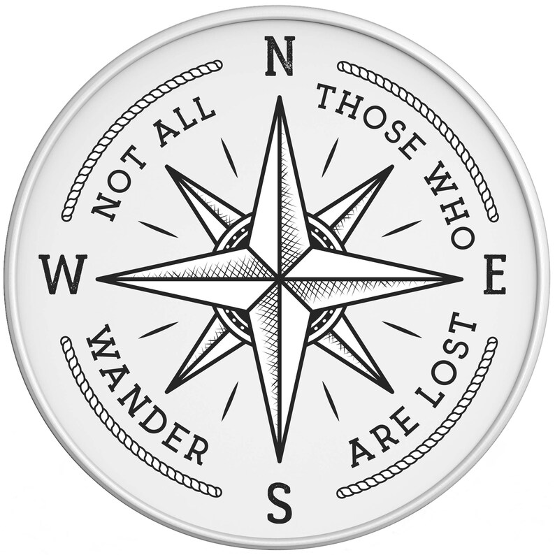 May include: Black and white compass with a star design and the text "Not all those who wander are lost" around the edge.