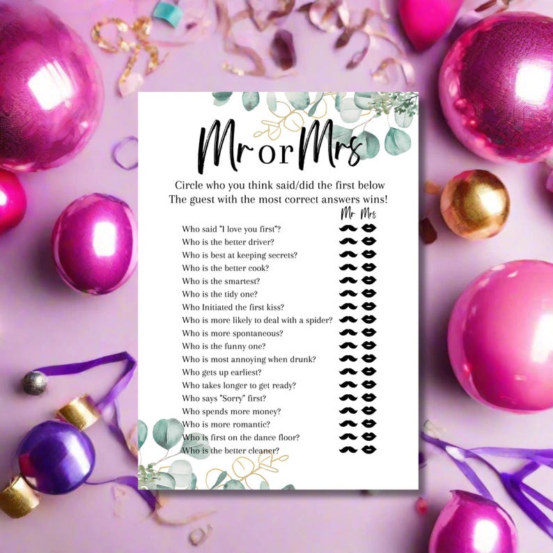 May include: A party game card with the text "Mr or Mrs" and a list of questions to determine who is the best match. The card is decorated with eucalyptus leaves and surrounded by pink and gold party decorations.