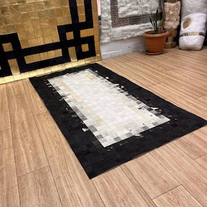 Natural Black & White Cowhide Patchwork Rug: Rustic Leather Area Rug