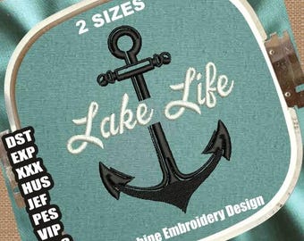 May include: Machine embroidery design featuring a black anchor with the text "Lake Life" in white cursive lettering. The design is available in two sizes.