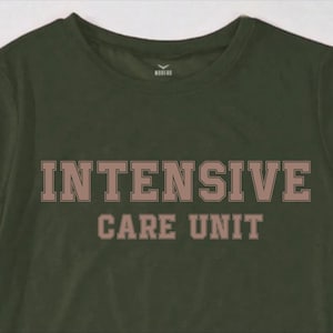 May include: A dark green t-shirt with the words "INTENSIVE CARE UNIT" printed in brown on the front.