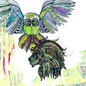 May include: A colorful illustration of the Strength tarot card, featuring an owl with outstretched wings hovering over a lion's head. The card number VIII and the word Strength are written at the top of the image. The image also includes symbols for the zodiac sign Leo, a square, a monkey, a third eye, a triangle, a female symbol, and a sword.