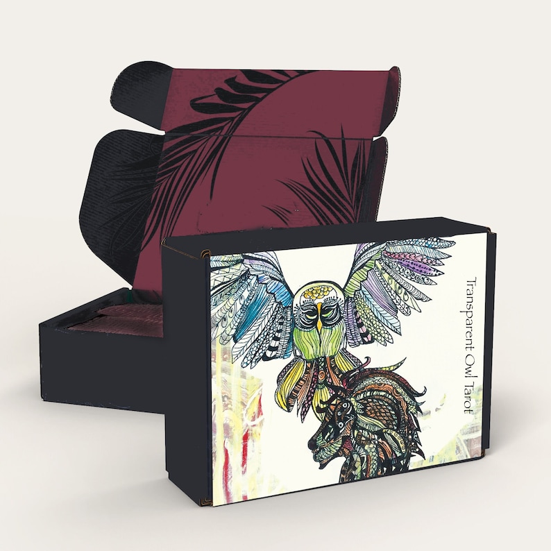 May include: A box for a tarot deck with a colorful illustration of an owl with its wings spread wide. The box is black with a white background and the text "Transparent Owl Tarot" is printed on the side.