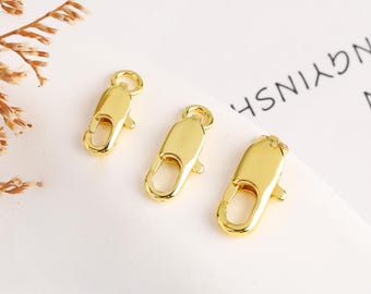 May include: Three gold-toned metal lobster clasps, each with a different size. The clasps are commonly used for jewelry making.