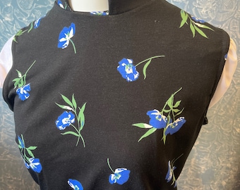Black super soft stretch vicar ,clergy,dickie vestment top with blue flower .made to order in soft black spandex .many sizes available