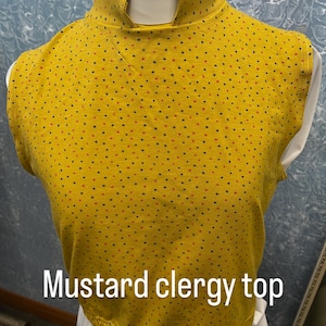 Black stretch vicar ,clergy,dickie vestment top .made to order in soft black spandex .many sizes available