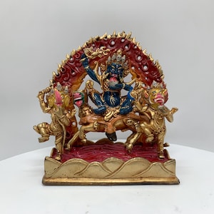 Gold plated Palden lhamo statue. Palden lhamo protector of dalai lama, shri devi with makar head dakini and lion head dakini on blood river.