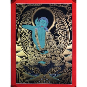 May include: A hand-painted thangka depicting a green-skinned deity seated in a meditative pose. The deity is surrounded by intricate gold and black patterns, including clouds and a halo. The thangka is framed in a red border.
