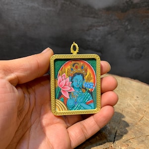 colorful green tara mini thangka pendant. 24k gold painted detail mini thangka painting. protector mother tara. ghau box, tibetan amulet