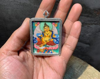 Hand painted mini dzambhala thangka painting. god of wealth. hand crafted metal pendant. thangka pendant.for prosperity. jambhala ghau box.