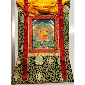 66x50 cm Dzambhala Thangka. jambhala thangka with silk brocade. God of wealth, Kubera, Jambala. Tibetan thangka. For prosperity and success.