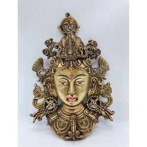 8 inch tall Green tara mask. made of brass. jetsun dolma. protector of beings. for good luck. compassionate mother. wall hanging decoration