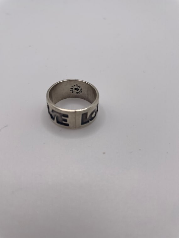 Sterling silver “LOVE” engraved ring