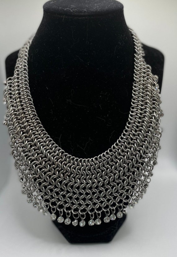 Silver tone bib necklace with rhinestones. Beautif