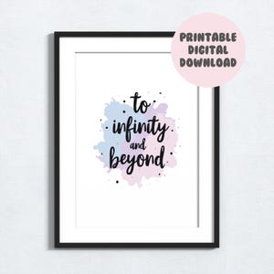 May include: Framed art print with the phrase "to infinity and beyond" in black script over a watercolor-style background of blue and purple hues. A pink circle in the upper right corner reads "Printable Digital Download".