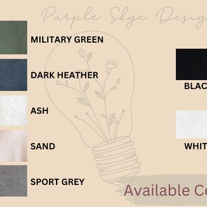 May include: A chart showing available colors for a t-shirt. The colors are: Military Green, Dark Heather, Black, Ash, Sand, White, and Sport Grey. The text "Purple Skye Designs" and "Available Colors" is also included.