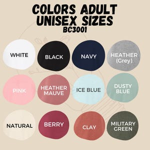 May include: Color chart showing available colors for adult unisex t-shirts. Colors include white, black, navy, heather grey, pink, heather mauve, ice blue, dusty blue, natural, berry, clay, and military green.