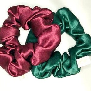 May include: Two satin scrunchies, one burgundy and one dark green.