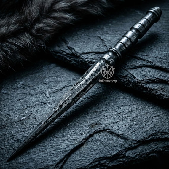 Damascus-patterned steel twisted into a letter opener — 27 people favorited a desk tool that looks like it belongs in a collector's cabinet, not a stationery drawer.