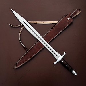 May include: A silver sword with a brown leather scabbard. The sword has a black handle and a silver blade. The scabbard has a strap for carrying.