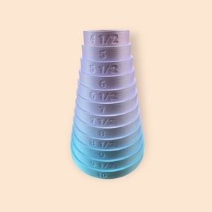May include: A set of 10 ring mandrels in a gradient of purple to blue. The mandrels are numbered from 4 1/2 to 10.