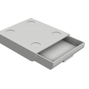 May include: A small, grey, rectangular box with a drawer that is partially open. The box has four circular indents on the top.