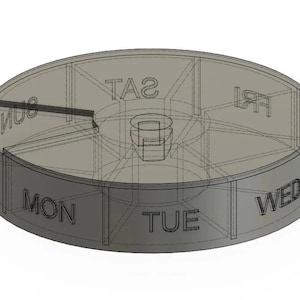 Puede incluir: Un organizador de pastillas de plástico gris con siete compartimentos etiquetados con los días de la semana: LUN, MAR, MIÉR, JUE, VIE, SÁB, DOM.