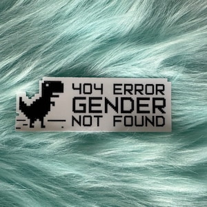 May include: A white sticker with a black pixelated dinosaur and the text "404 ERROR GENDER NOT FOUND".