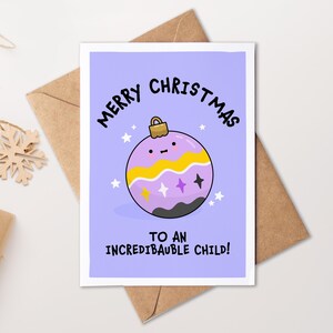 May include: A Christmas card with a purple background and a cartoon bauble design. The bauble has yellow and purple stripes, and the text reads "Merry Christmas to an IncrediBauble Child!" The card is on a brown envelope.