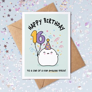 May include: A light blue birthday card featuring a white ghost holding a purple number 16 balloon. The ghost is wearing a party hat and there is confetti around it. The card reads "Happy Birthday" and "To a one of a kind amazing sprog!"
