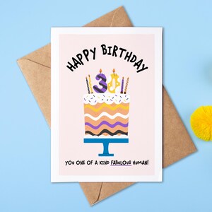 May include: A pink birthday card featuring a cake illustration and the text "Happy Birthday 3! You one of a kind fabulous human!"