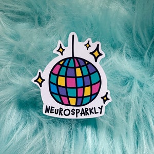 May include: A white sticker featuring a colourful disco ball and the text "Neurosparkly".