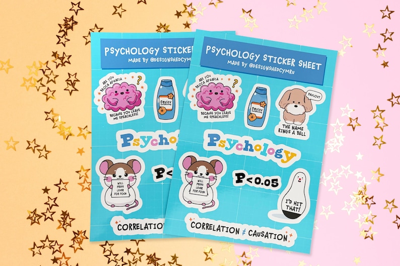May include: Two psychology sticker sheets with various cartoon illustrations, including a brain, a bottle, a dog, a mouse, and a bowling pin. The stickers have text like "Psycho" and "Correlation &ne; Causation". The background is decorated with gold stars.