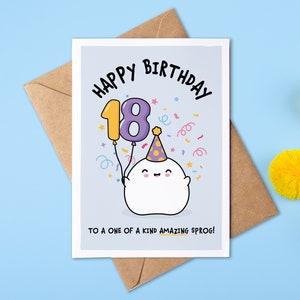 May include: Happy 18th birthday card featuring a cute cartoon ghost wearing a party hat and holding a purple balloon with the number 18. The card has a blue background with confetti and the text "Happy Birthday to a one of a kind amazing sprog!"