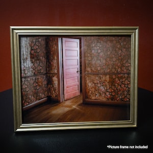 May include: A vintage-style photograph of a room with floral wallpaper and a closed wooden door. The room is empty and the door is slightly ajar, revealing a glimpse of a hallway beyond.