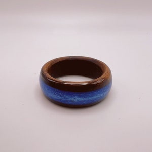 Dark wood ring with pearl blue inlay