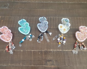 Mother and baby badge reel