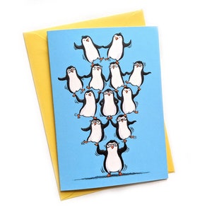 Carte de voeux de pingouins en équilibre. Carte illustrée A6.