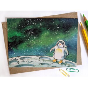 Carte de voeux de pingouin de l'espace. Carte illustrée A6