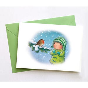 Carte de Noël de Robin sur une branche. Carte illustrée d'une petite fille et d'un rouge-gorge dans la neige. Une seule carte ou des lots de 2, 4 ou 8