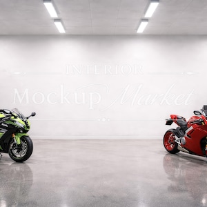 May include: A modern garage interior featuring two motorcycles. A green and black sport bike is on the left, and a red sport bike is on the right. The garage has a concrete floor, white walls, and overhead lighting.