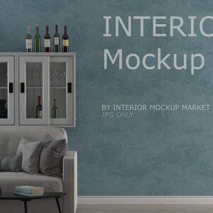 May include: Interior mockup featuring a gray sofa, a black coffee table, and a white cabinet with glass doors. The cabinet displays wine bottles and glasses. The wall is a textured teal color, with the text "INTERIOR Mockup".