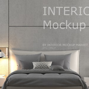 May include: A modern bedroom interior mockup featuring a bed with gray bedding and pillows. A white bedside table holds a lamp, books, and a coffee cup. The wall has the text "INTERIOR Mockup".